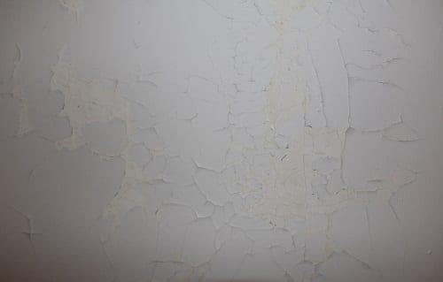 Typical map cracking and paint delaminating
