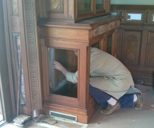 Repair of water damage in the inside of the cabinets in the library