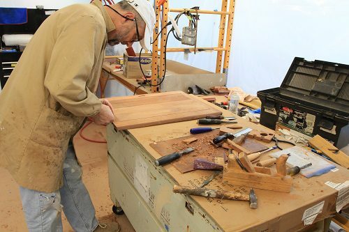 Renato working on wood restoration in the Canning studio
